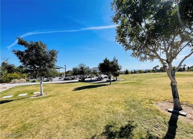 view of property's community with a gazebo and a yard