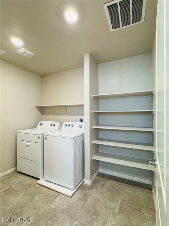 laundry area with separate washer and dryer