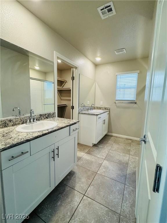 bathroom featuring vanity and tile patterned floors