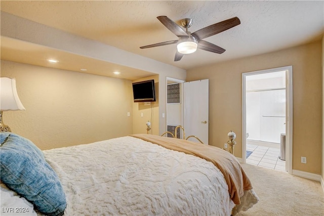 bedroom featuring light carpet and ceiling fan