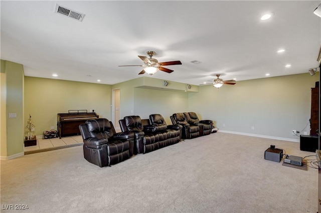 carpeted cinema featuring ceiling fan