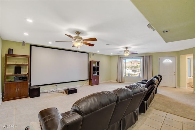 cinema room with light carpet and ceiling fan