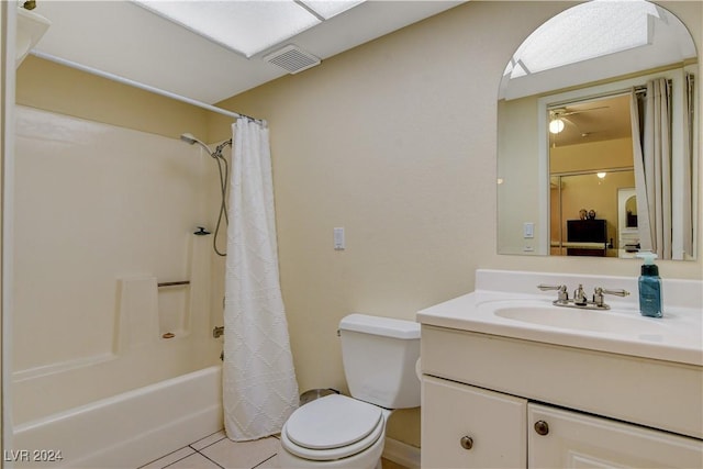 full bathroom featuring tile patterned flooring, vanity, shower / tub combo, and toilet