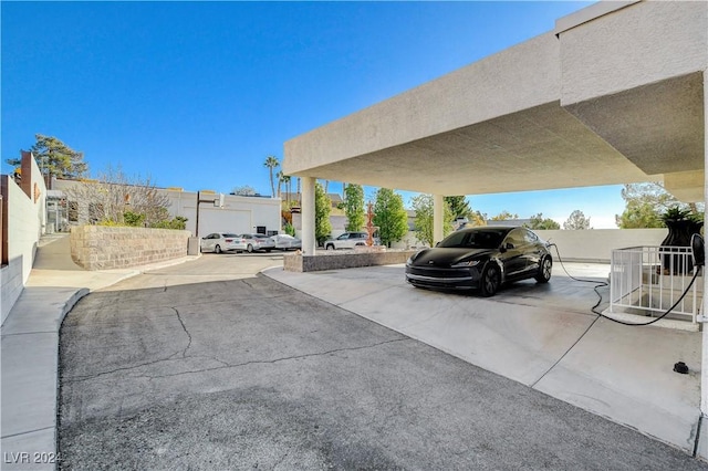 view of vehicle parking featuring a carport