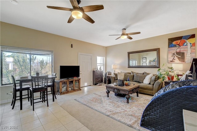 tiled living room featuring ceiling fan