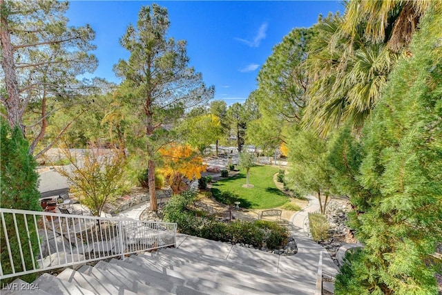 view of property's community featuring a yard