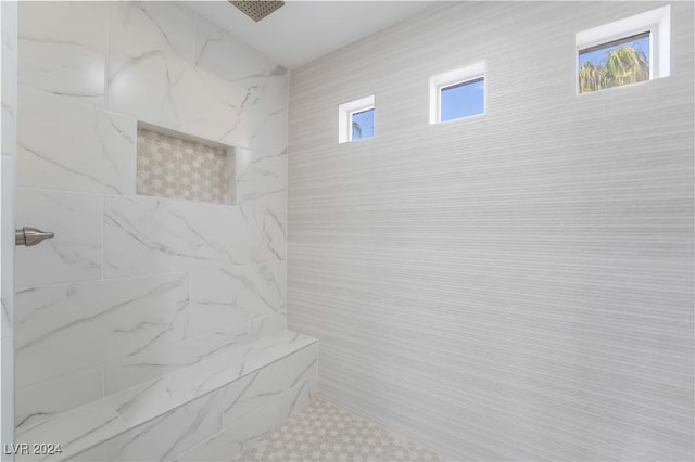 bathroom featuring tiled shower