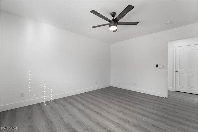 spare room with ceiling fan and hardwood / wood-style flooring