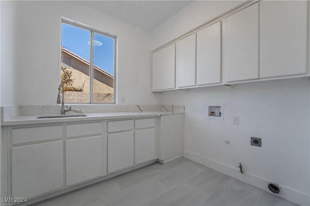 clothes washing area with sink, cabinets, electric dryer hookup, gas dryer hookup, and hookup for a washing machine