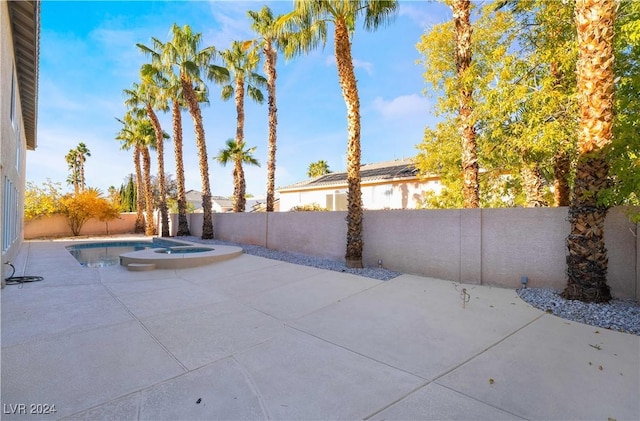 view of patio featuring a fenced in pool