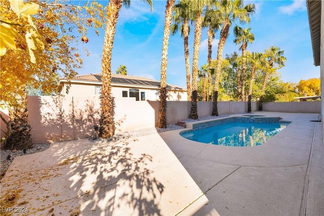 view of swimming pool featuring a patio area