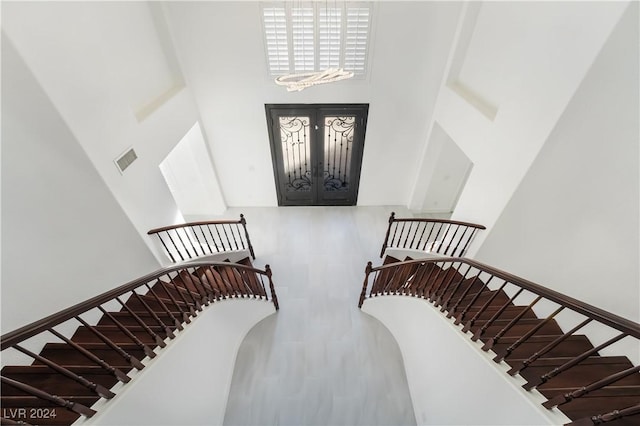 stairway with a towering ceiling