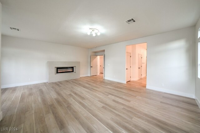 unfurnished living room with light wood-type flooring