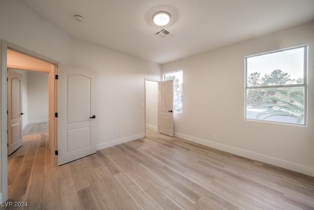 unfurnished bedroom featuring light wood-type flooring