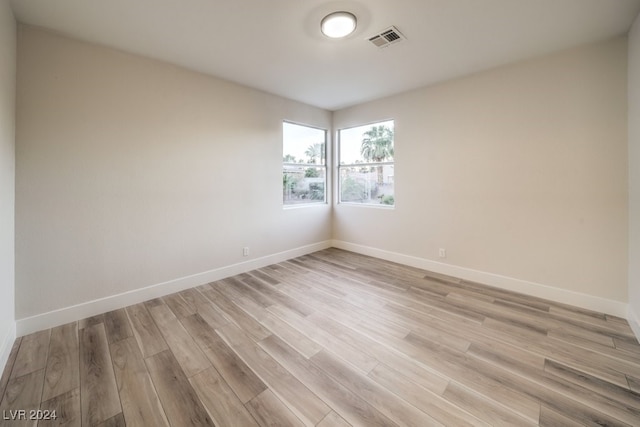 spare room with light wood-type flooring