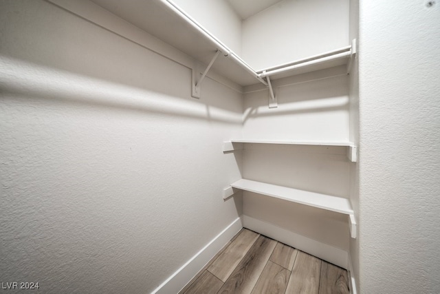 walk in closet featuring light wood-type flooring