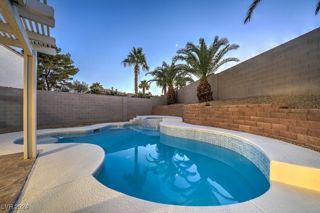 view of pool with an in ground hot tub