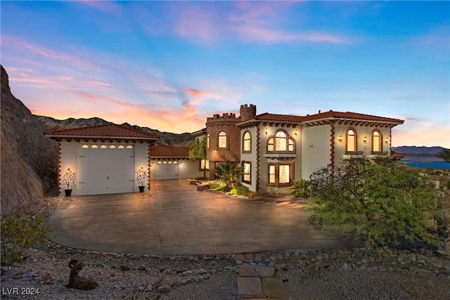 mediterranean / spanish-style house with a mountain view