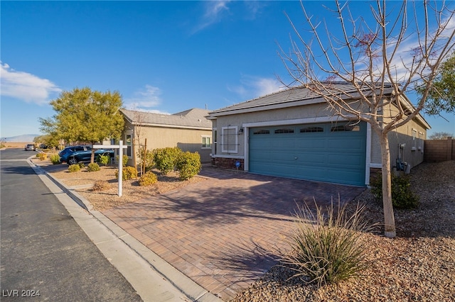 ranch-style home with a garage