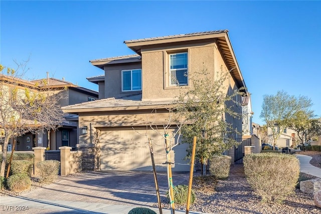 view of front of home with a garage