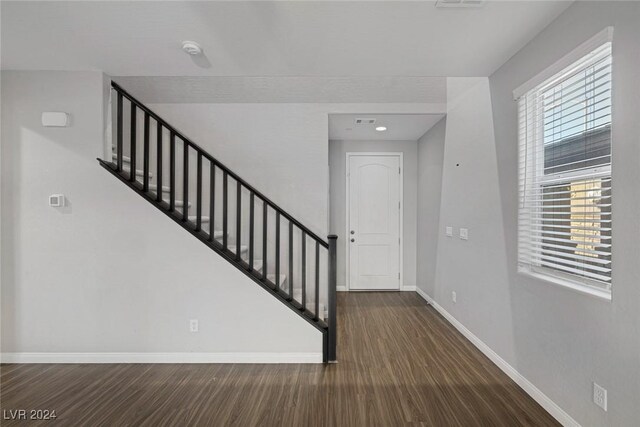 entrance foyer with dark hardwood / wood-style floors