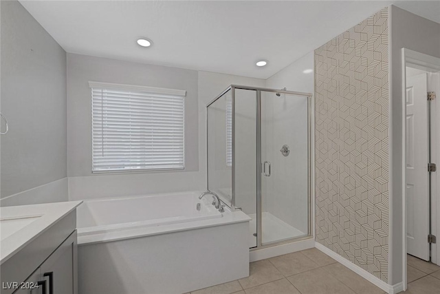 bathroom featuring tile patterned floors, vanity, and separate shower and tub