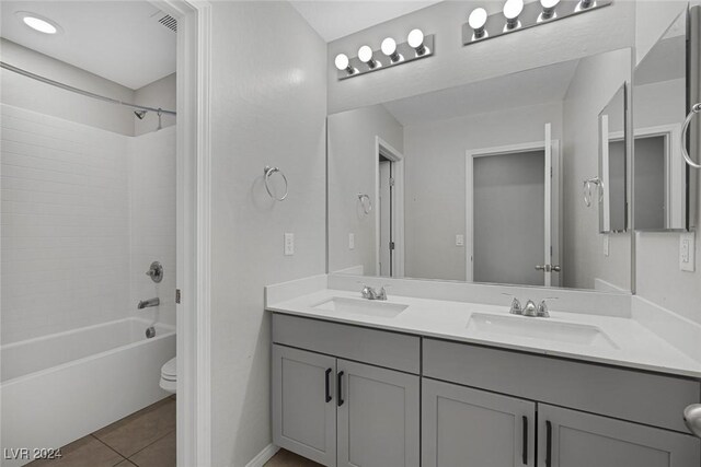 full bathroom featuring toilet, shower / bath combination, tile patterned floors, and vanity