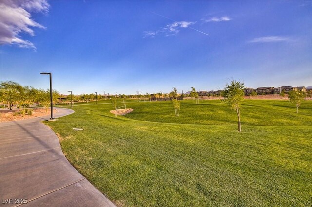 view of property's community with a lawn