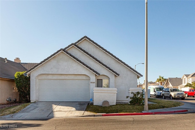 ranch-style home with a garage