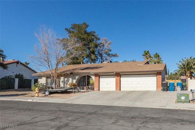 view of front of home with a garage and concrete driveway