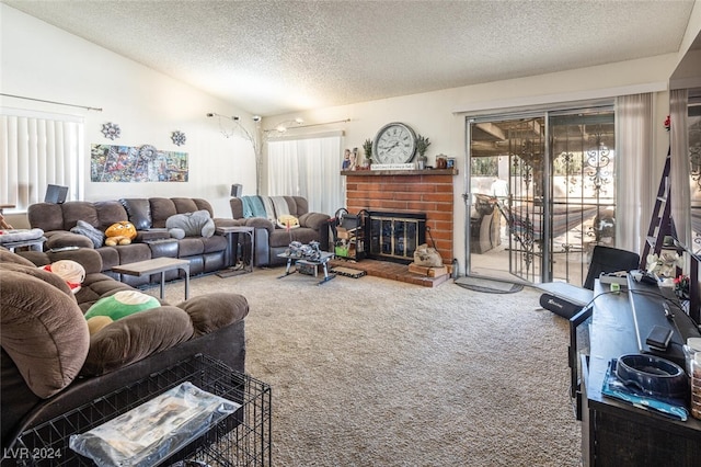 carpeted living room with vaulted ceiling, a textured ceiling, and a brick fireplace