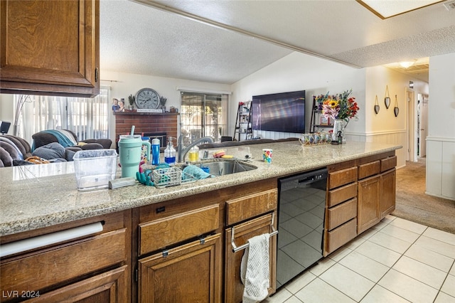 kitchen featuring light stone countertops, dishwasher, a textured ceiling, vaulted ceiling, and light tile patterned flooring