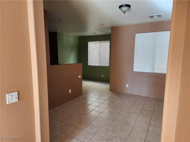 spare room with light tile patterned floors