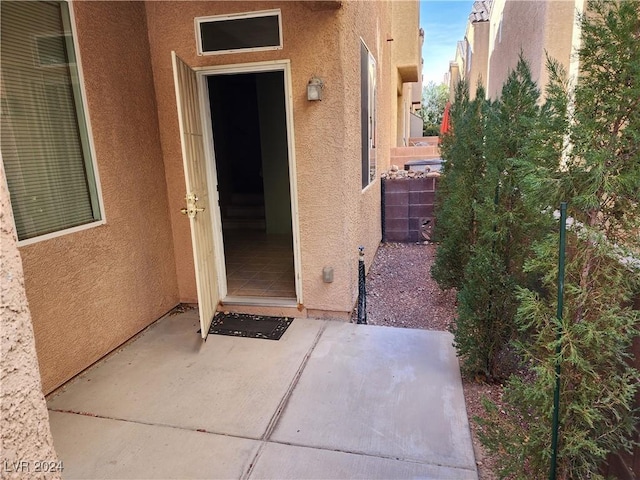 entrance to property with a patio area