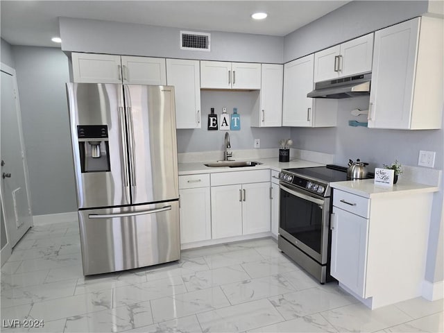 kitchen featuring white cabinetry, sink, and appliances with stainless steel finishes