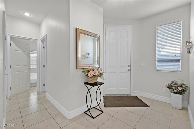 tiled foyer entrance with plenty of natural light