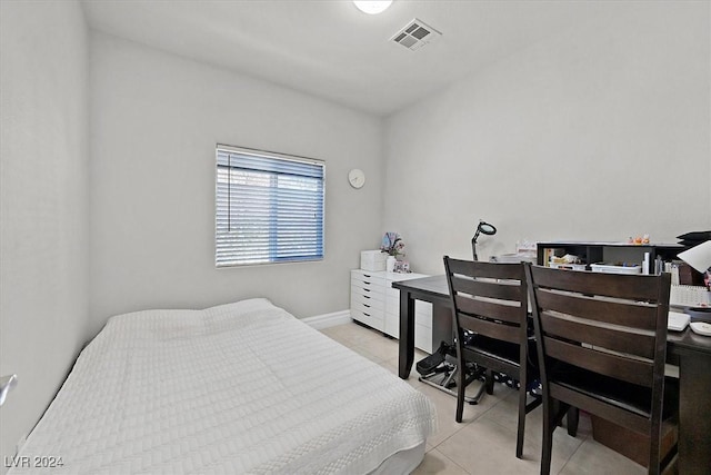 bedroom featuring light tile patterned flooring