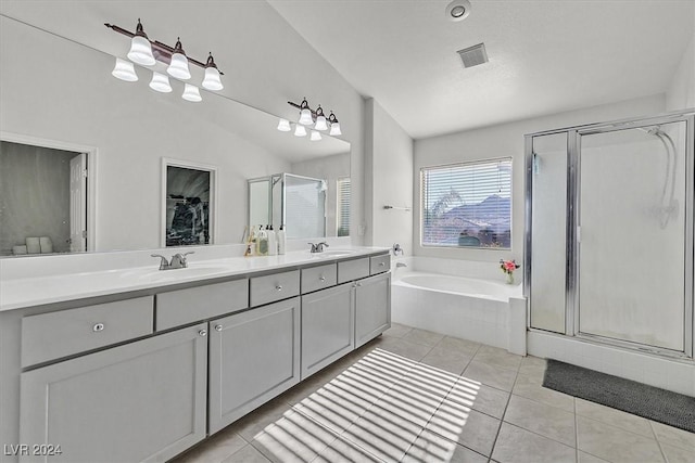 bathroom featuring shower with separate bathtub, vanity, tile patterned floors, and lofted ceiling