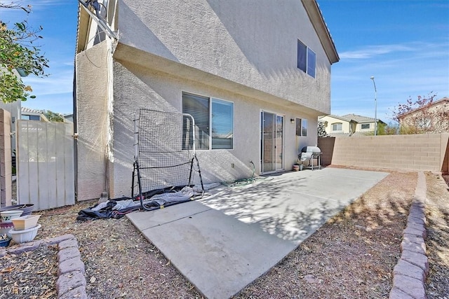 rear view of house with a patio