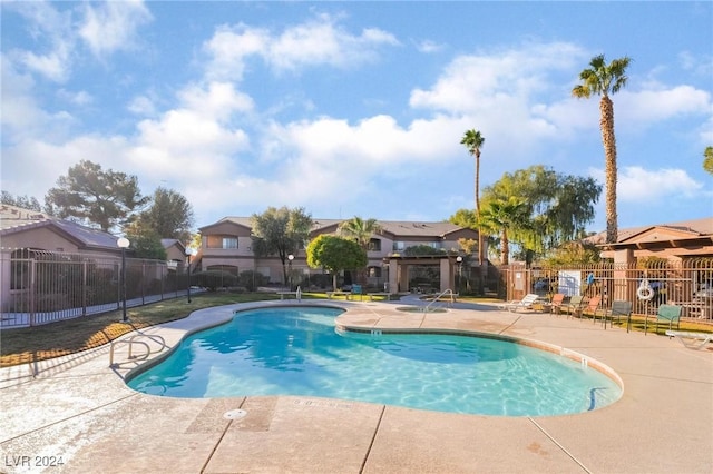 view of swimming pool featuring a patio area