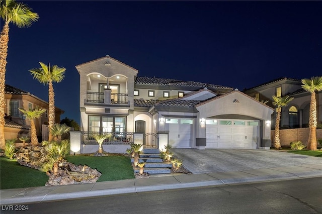 2781 Josephine Dr, Henderson, NV 89044 - mediterranean / spanish home featuring a balcony, stucco siding, a tile roof, driveway, and a garage