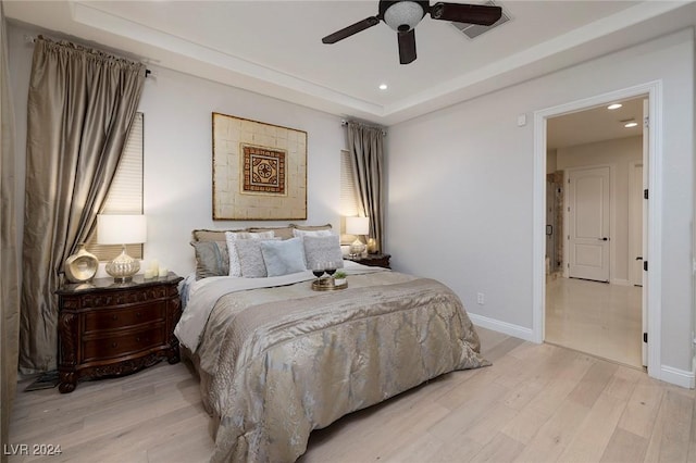 2781 Josephine Dr, Henderson, NV 89044 - bedroom featuring light wood-style flooring, recessed lighting, a tray ceiling, and ceiling fan