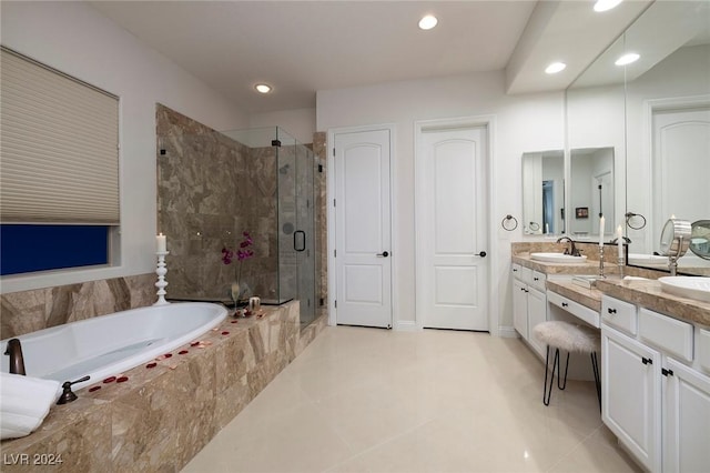 bathroom featuring plus walk in shower and vanity