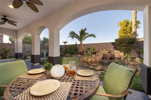 2781 Josephine Dr, Henderson, NV 89044 - fenced backyard featuring outdoor dining space, a ceiling fan, and a patio