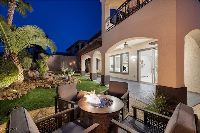 2781 Josephine Dr, Henderson, NV 89044 - patio at twilight featuring a fire pit, a patio, a balcony, and a ceiling fan