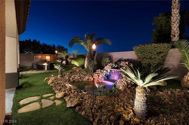 2781 Josephine Dr, Henderson, NV 89044 - yard at night featuring a fenced backyard