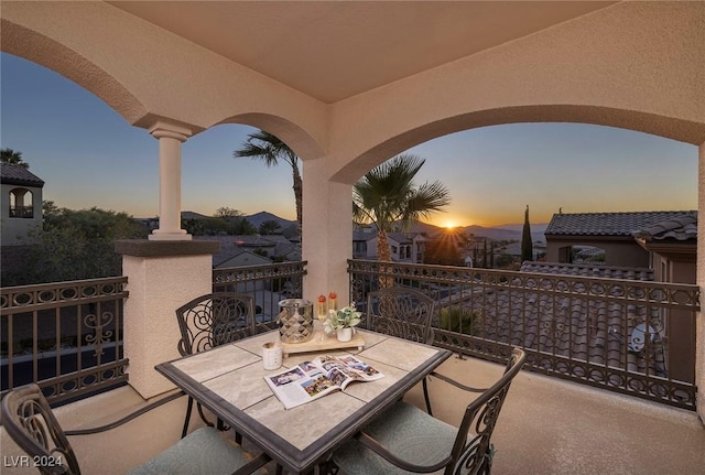 patio terrace at dusk with a balcony