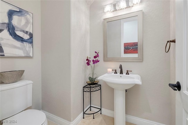 bathroom featuring tile patterned floors, sink, and toilet