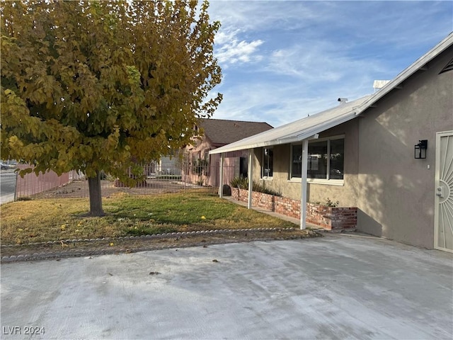 view of home's exterior with a yard