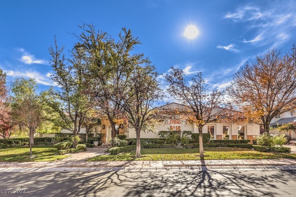 mediterranean / spanish-style home with a front yard